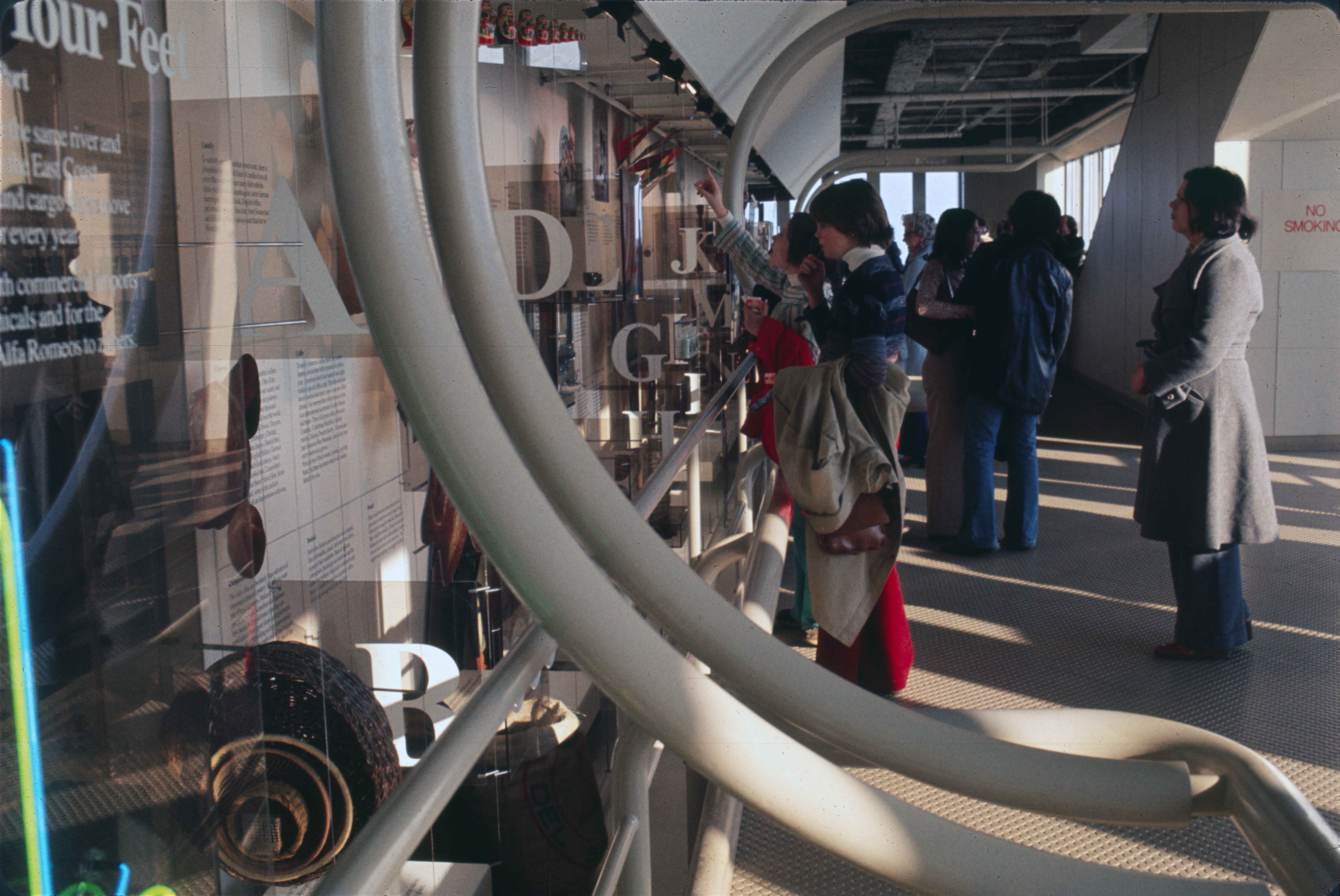 people looking at an exhibition